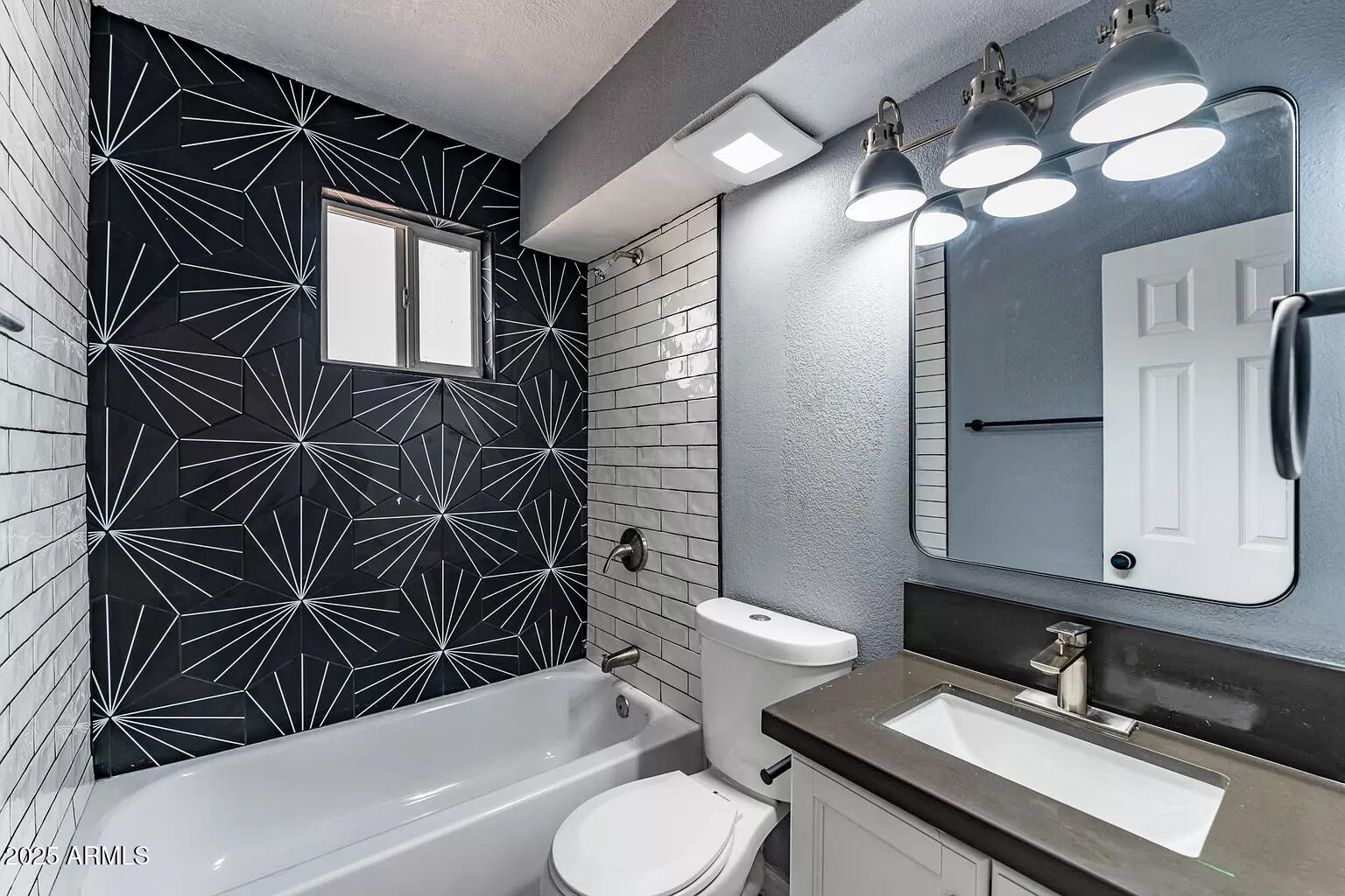 2014 West Berridge Lane Phoenix, AZ 85015 - Photo 20 of 23 a bathroom with a sink and a mirror