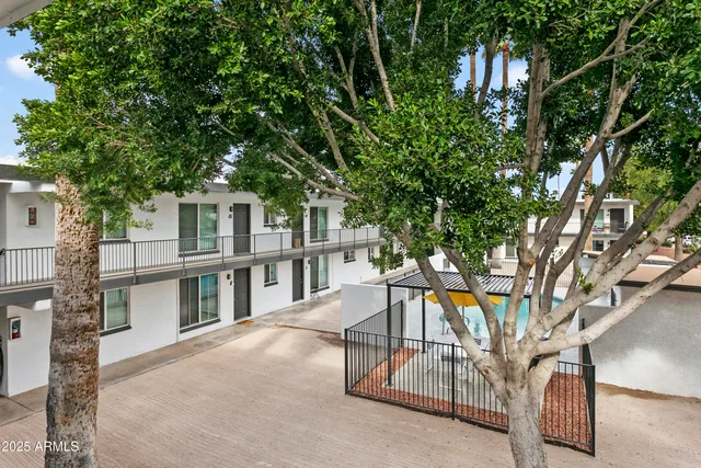a view of a house with a tree