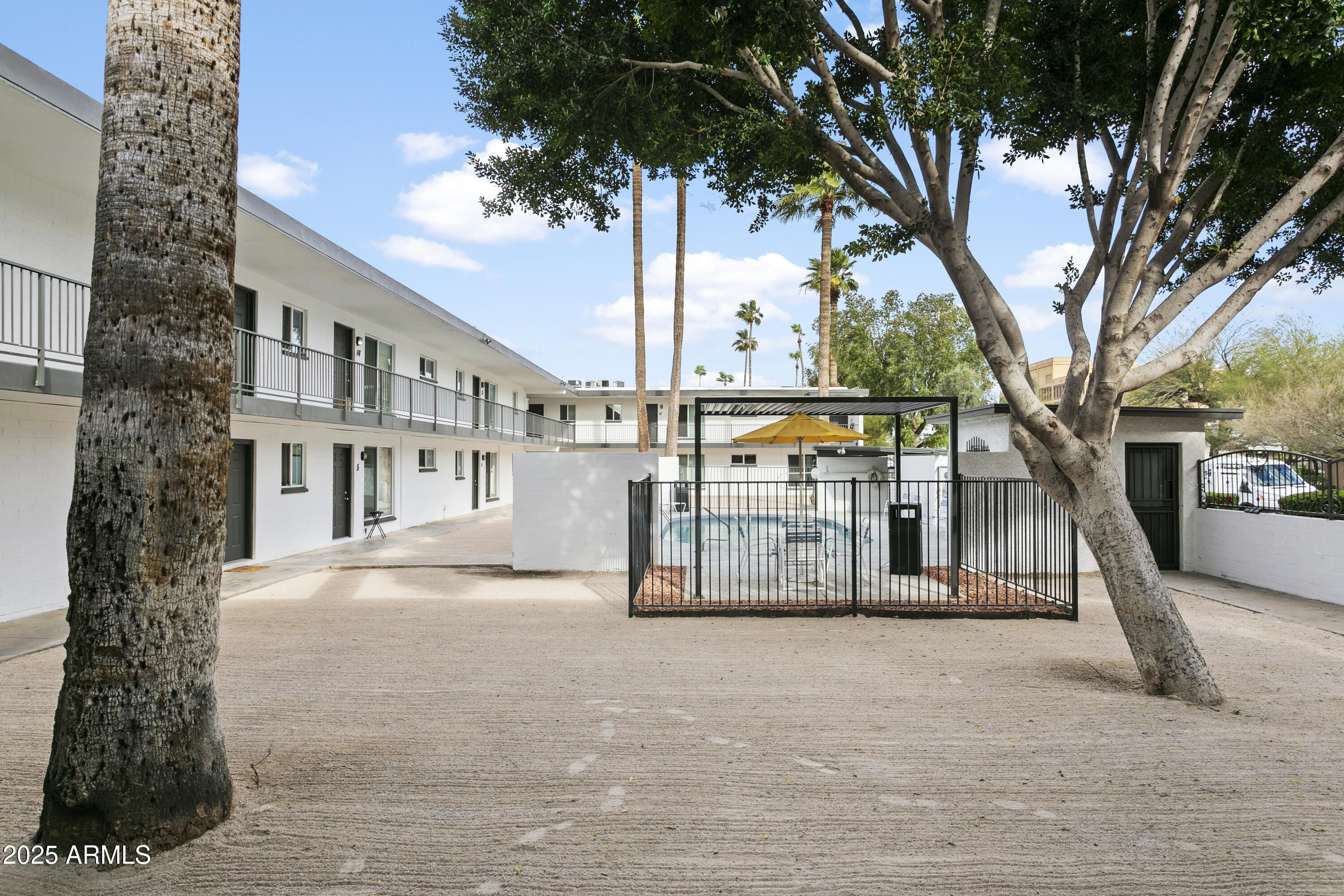 2014 West Berridge Lane Phoenix, AZ 85015 - Photo 5 of 23 a view of a building with a tree
