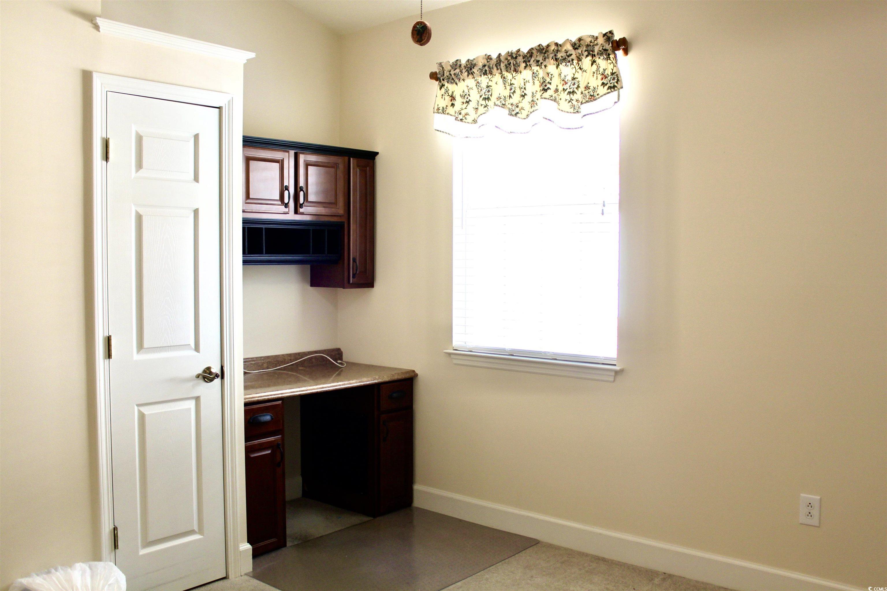 854 Laquinta Loop Murrells Inlet, SC 29576 - Photo 19 of 38 Kitchen featuring dark brown cabinetry