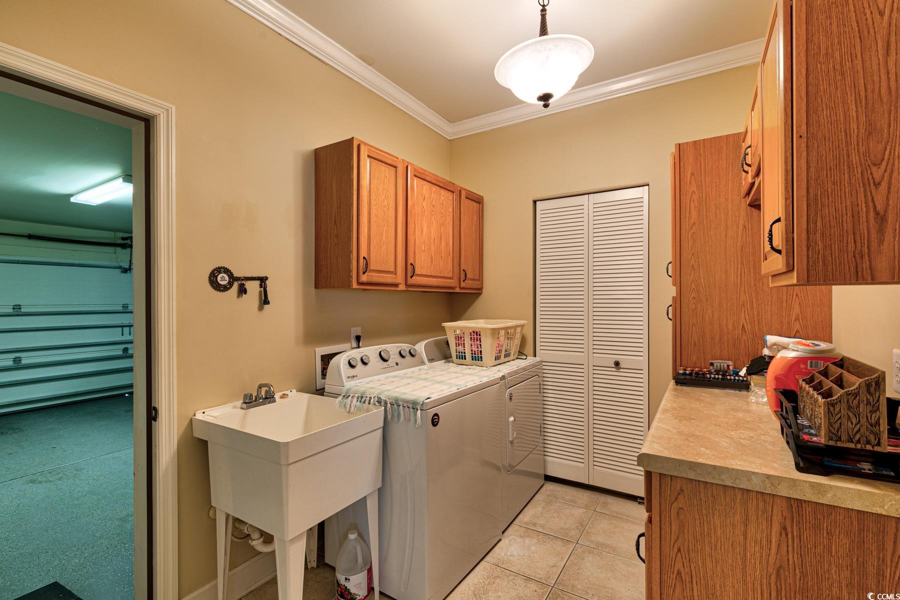 854 Laquinta Loop Murrells Inlet, SC 29576 - Photo 24 of 38 Washroom with light tile patterned floors, crown m