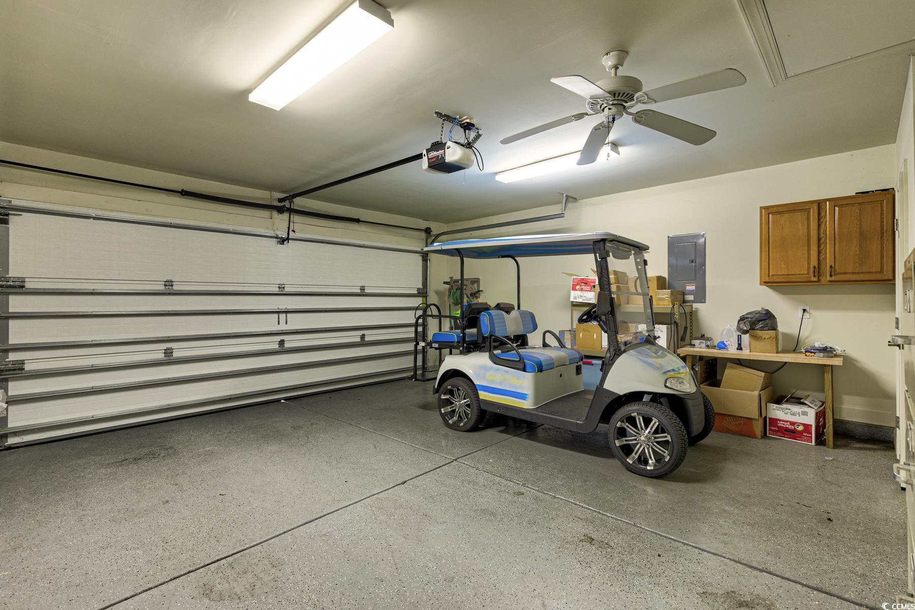 854 Laquinta Loop Murrells Inlet, SC 29576 - Photo 29 of 38 Garage featuring a garage door opener, ceiling fan