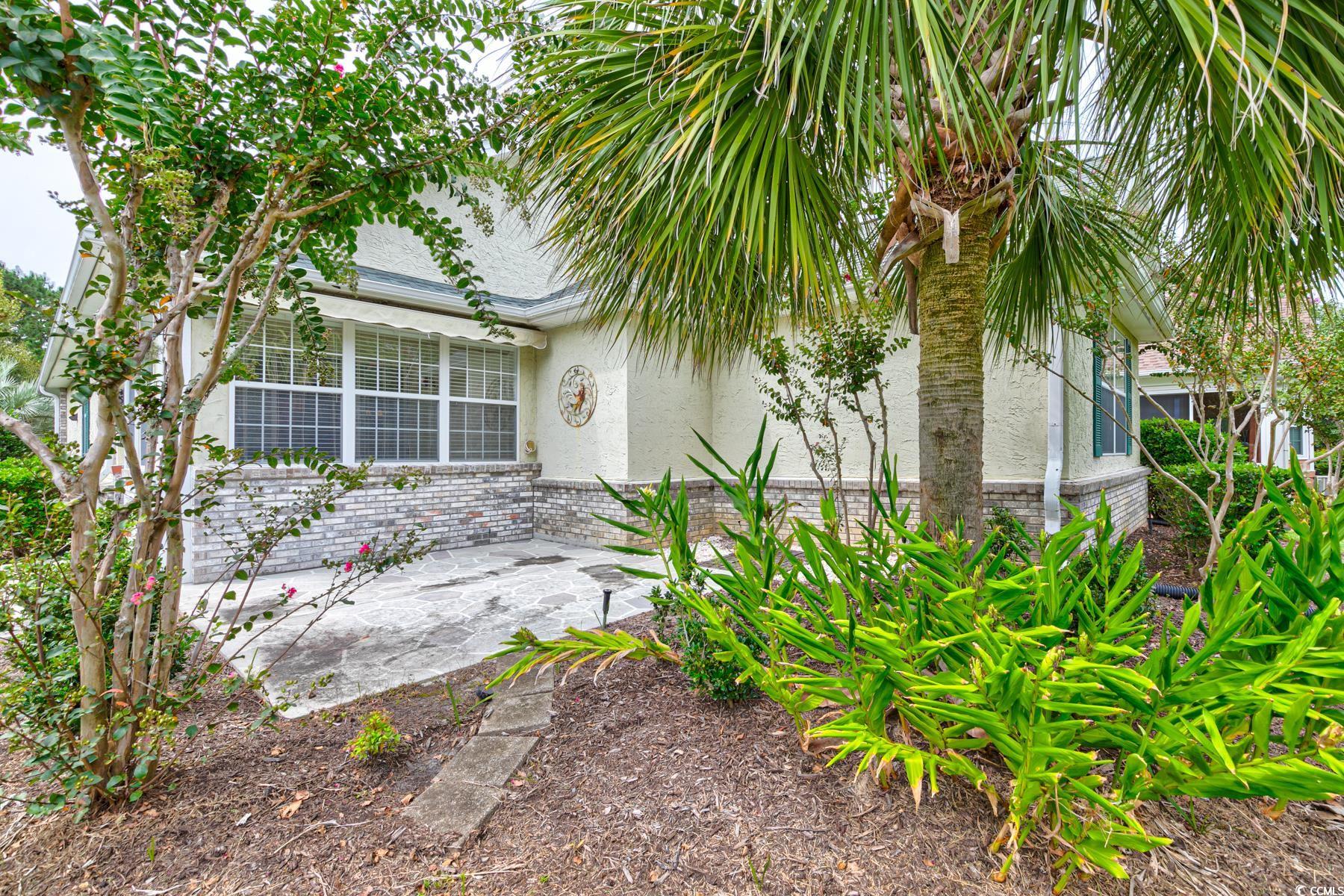 854 Laquinta Loop Murrells Inlet, SC 29576 - Photo 32 of 38 View of property exterior featuring a patio