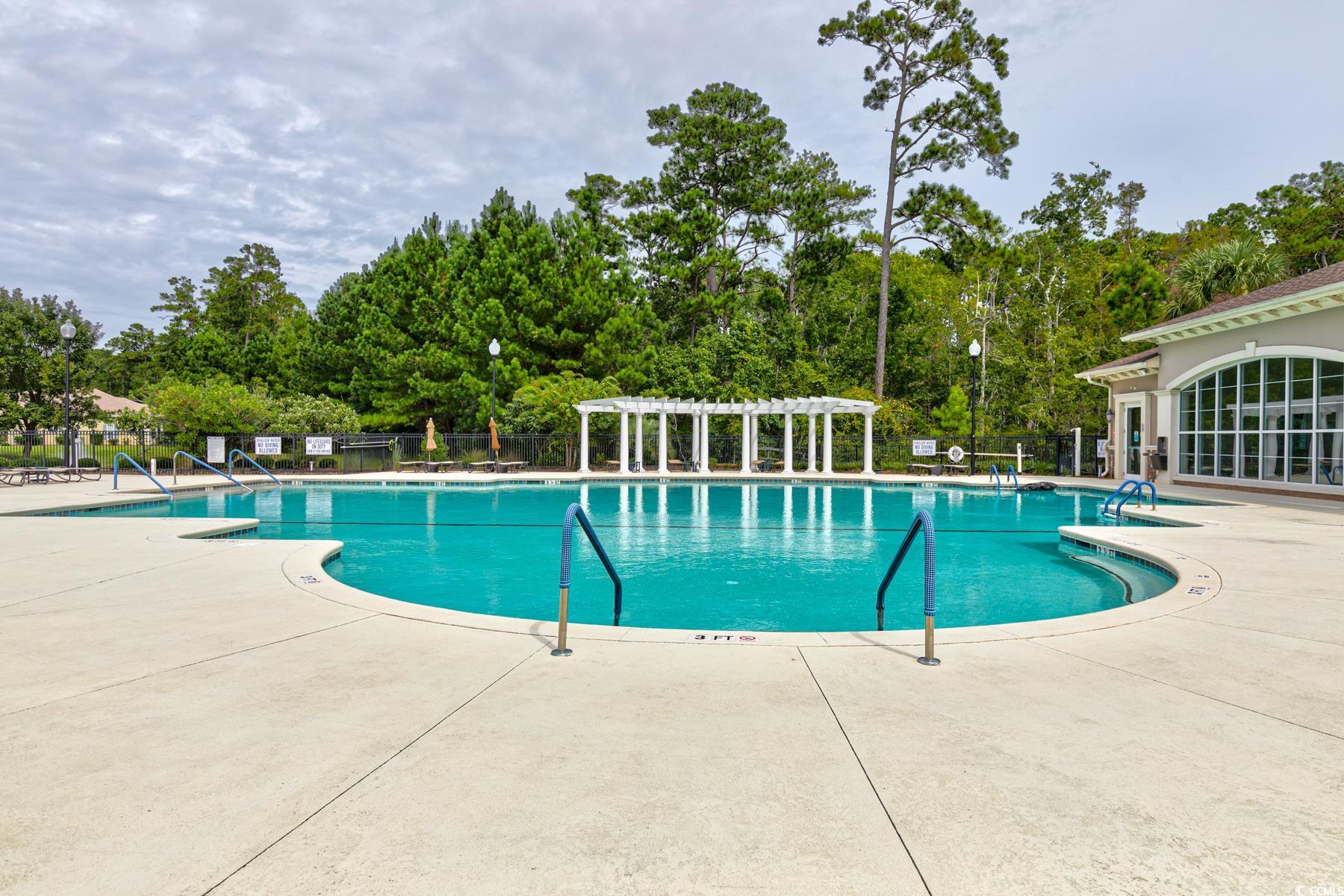 854 Laquinta Loop Murrells Inlet, SC 29576 - Photo 34 of 38 View of swimming pool with a patio area