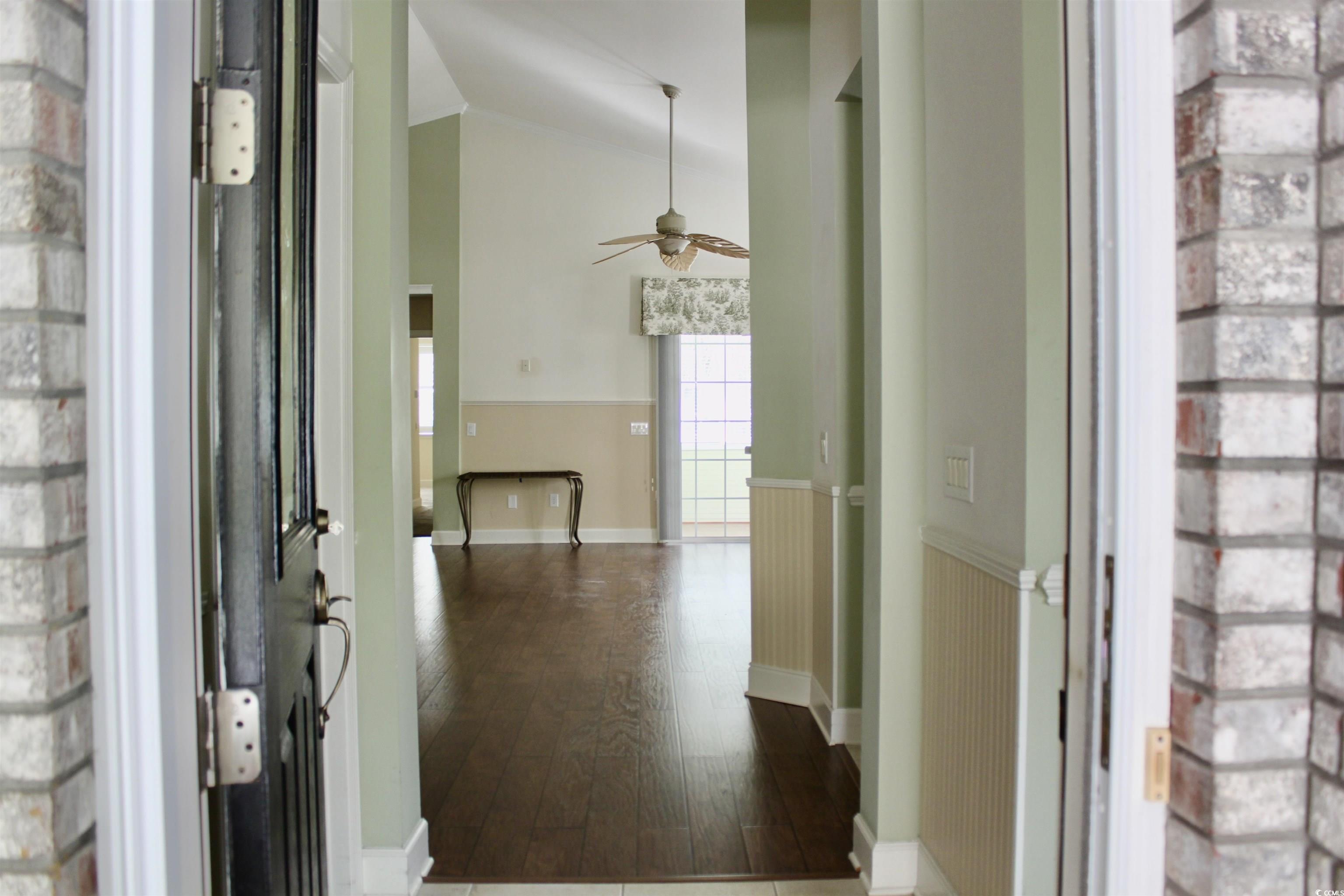 854 Laquinta Loop Murrells Inlet, SC 29576 - Photo 4 of 38 Hallway with dark hardwood / wood-style flooring a