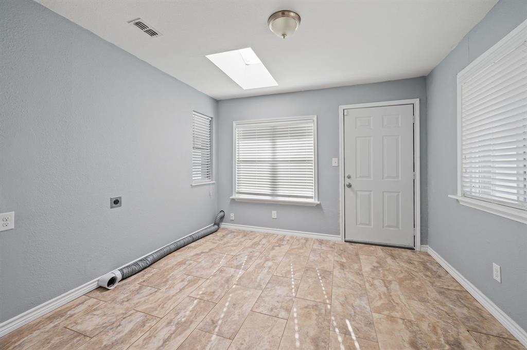 904 Treasure Road Garland, TX 75041 - Photo 15 of 27 a view of empty room with windows
