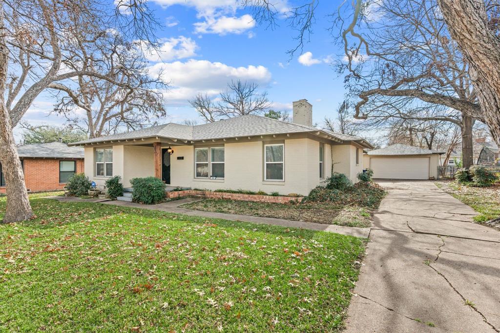 904 Treasure Road Garland, TX 75041 - Photo 2 of 27 a view of a yard with a house