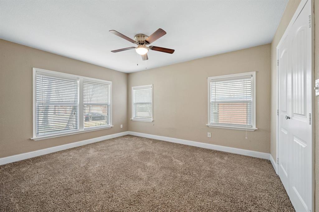 904 Treasure Road Garland, TX 75041 - Photo 21 of 27 a view of an empty room with a window