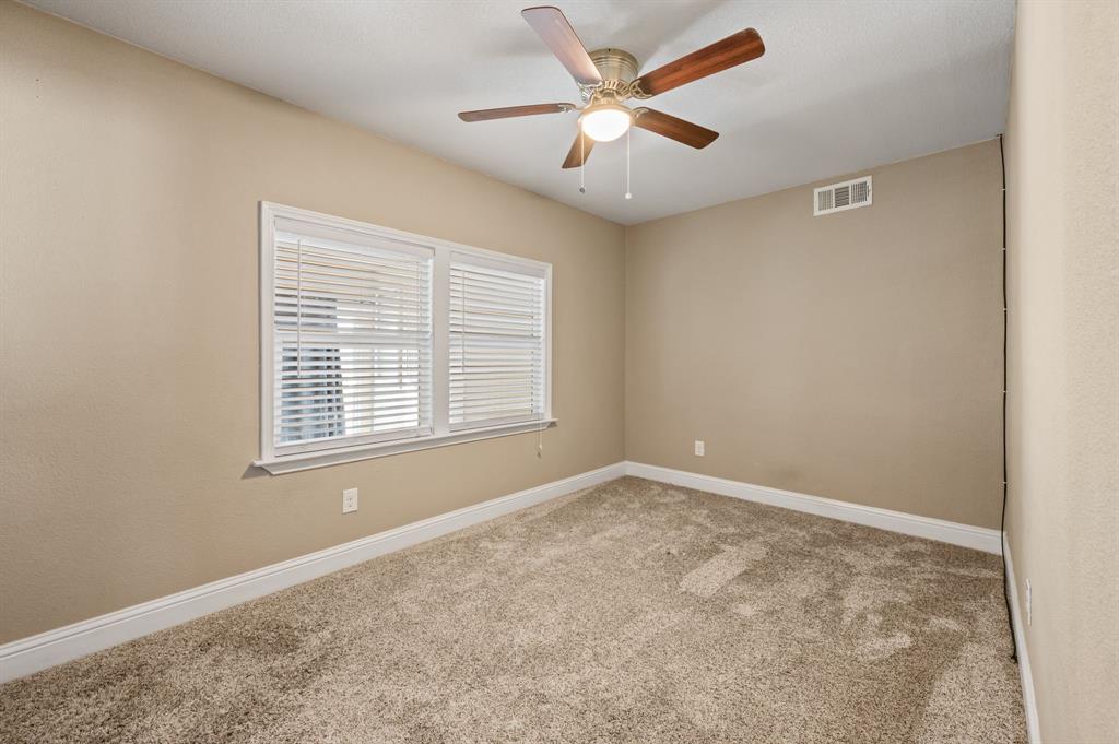 904 Treasure Road Garland, TX 75041 - Photo 23 of 27 an empty room with a window