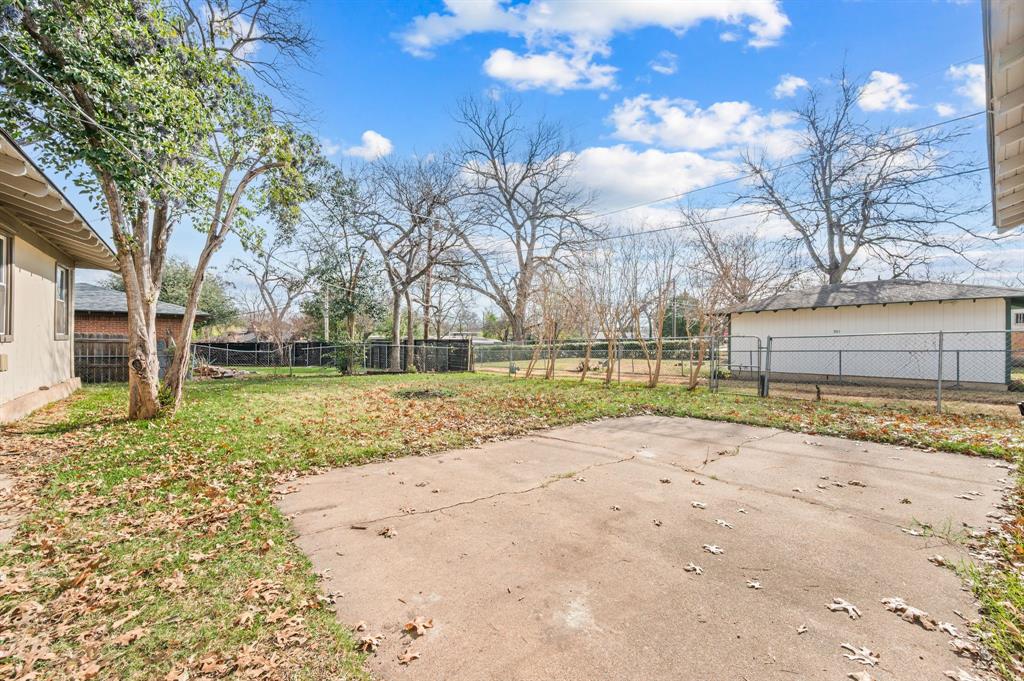 904 Treasure Road Garland, TX 75041 - Photo 24 of 27 a view of a yard with a house