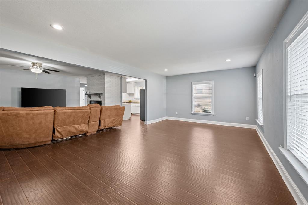 904 Treasure Road Garland, TX 75041 - Photo 5 of 27 a living room with furniture and a flat screen tv