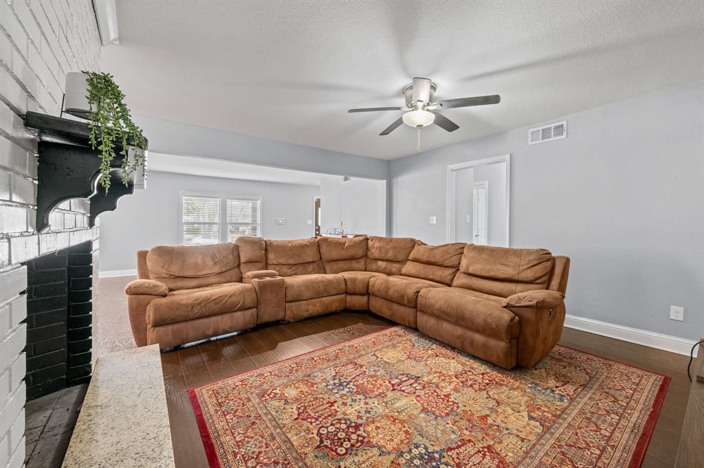 904 Treasure Road Garland, TX 75041 - Photo 10 of 27 a living room with furniture and a rug