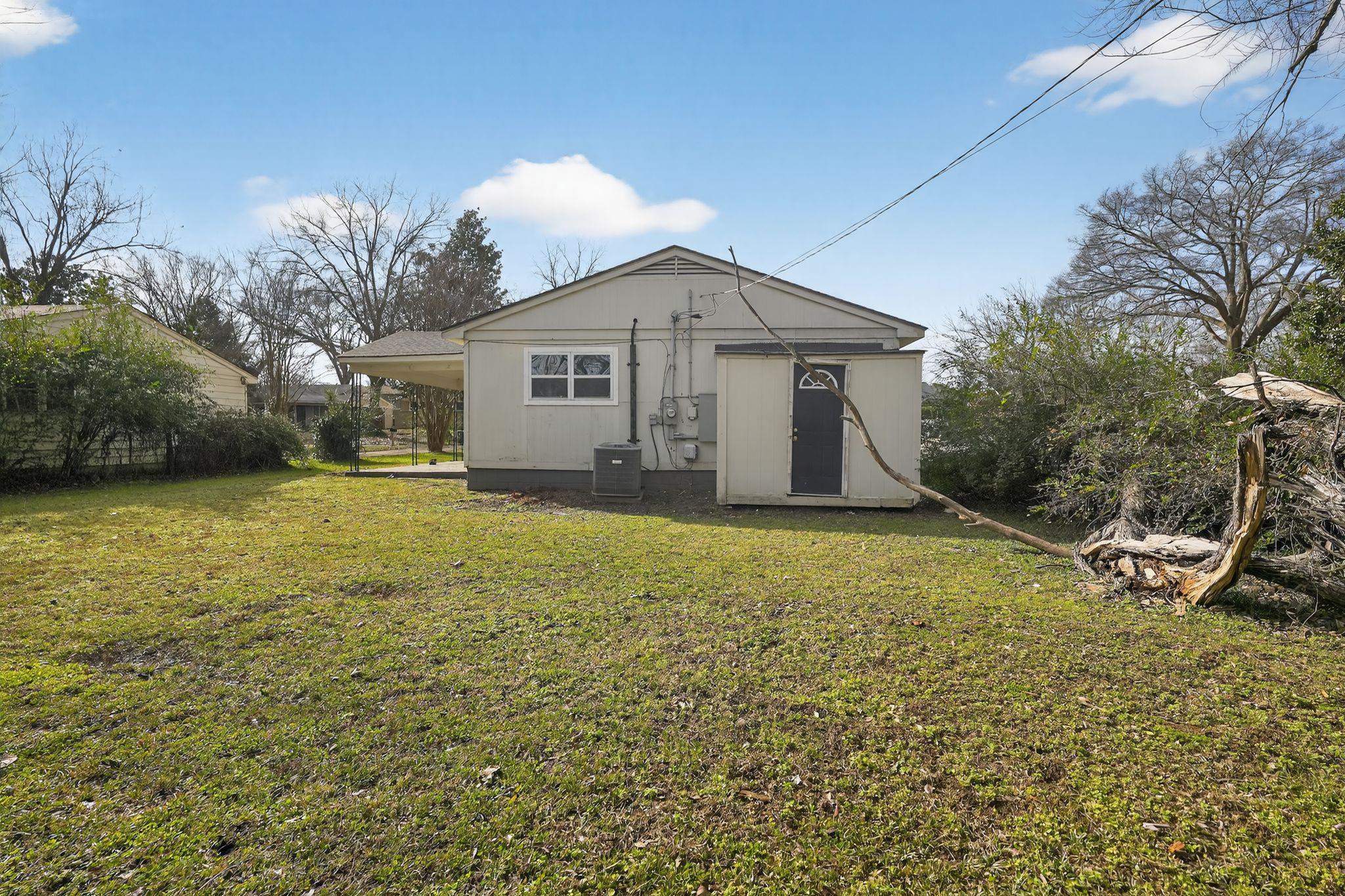 4212 Falcon Drive Memphis, TN 38109 - Photo 14 of 31 Back of property featuring a yard