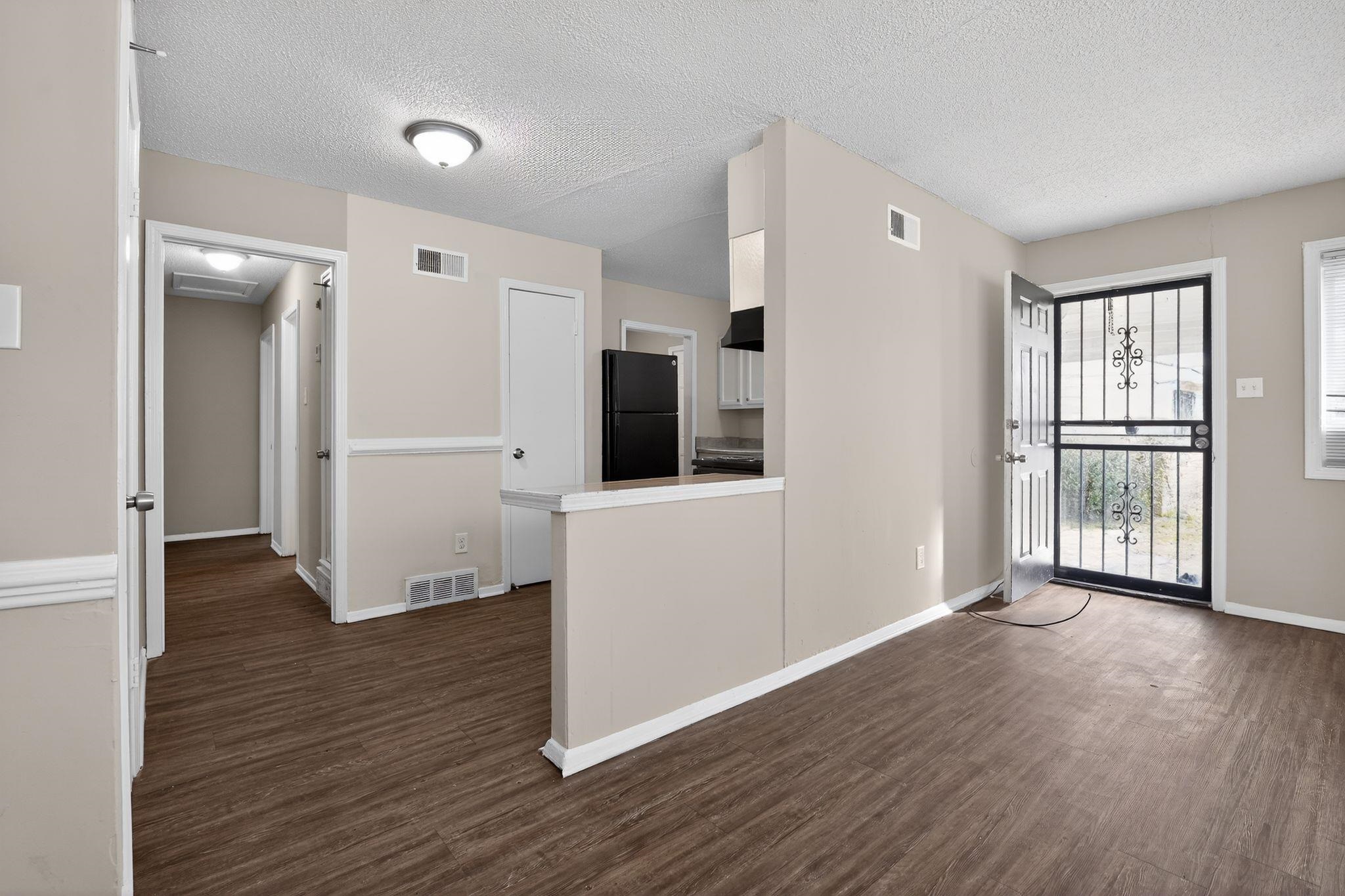 4212 Falcon Drive Memphis, TN 38109 - Photo 21 of 31 Foyer with dark wood-style flooring and a textured ceiling