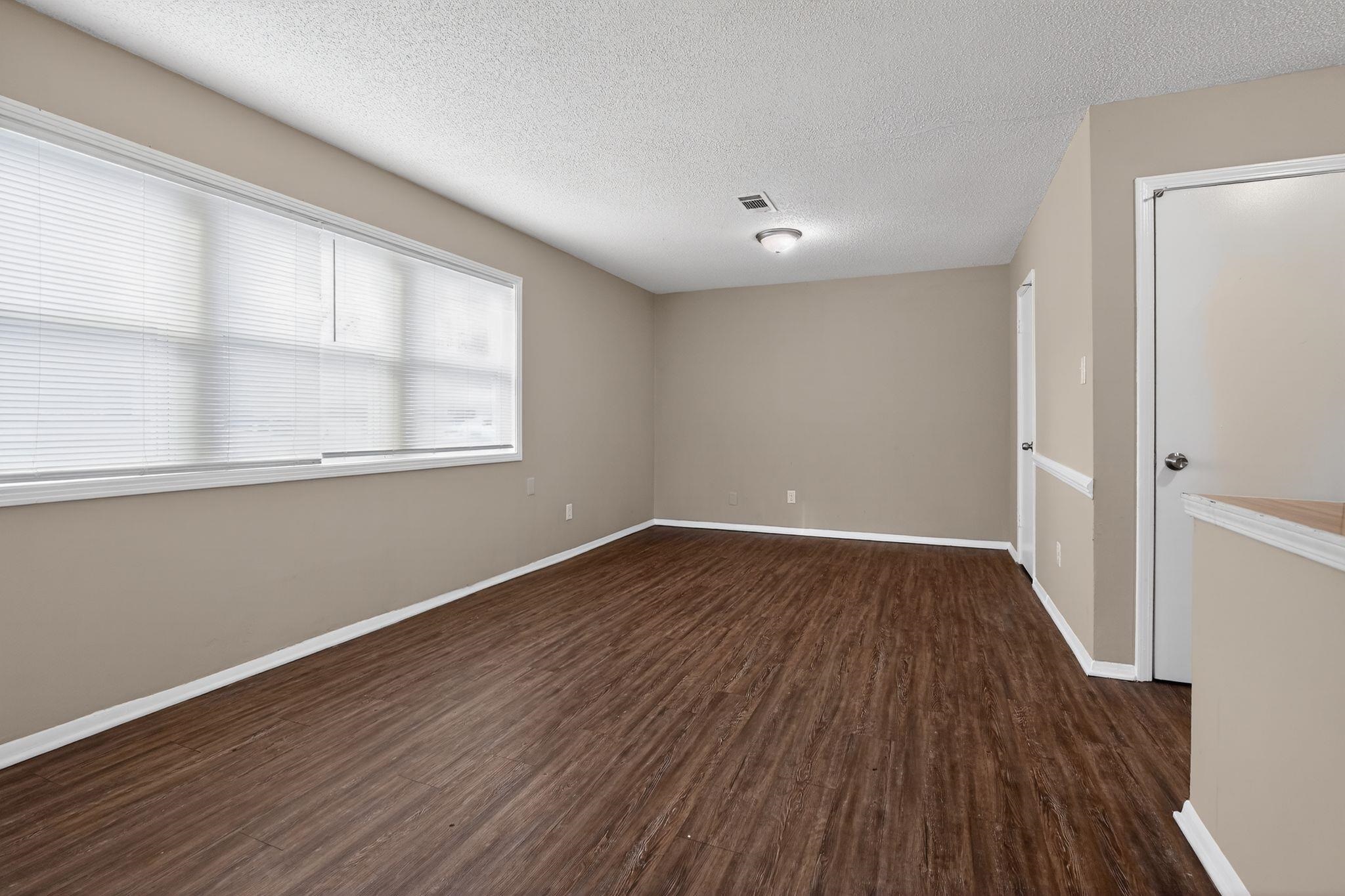 4212 Falcon Drive Memphis, TN 38109 - Photo 23 of 31 Unfurnished room with dark wood finished floors and a textured ceiling