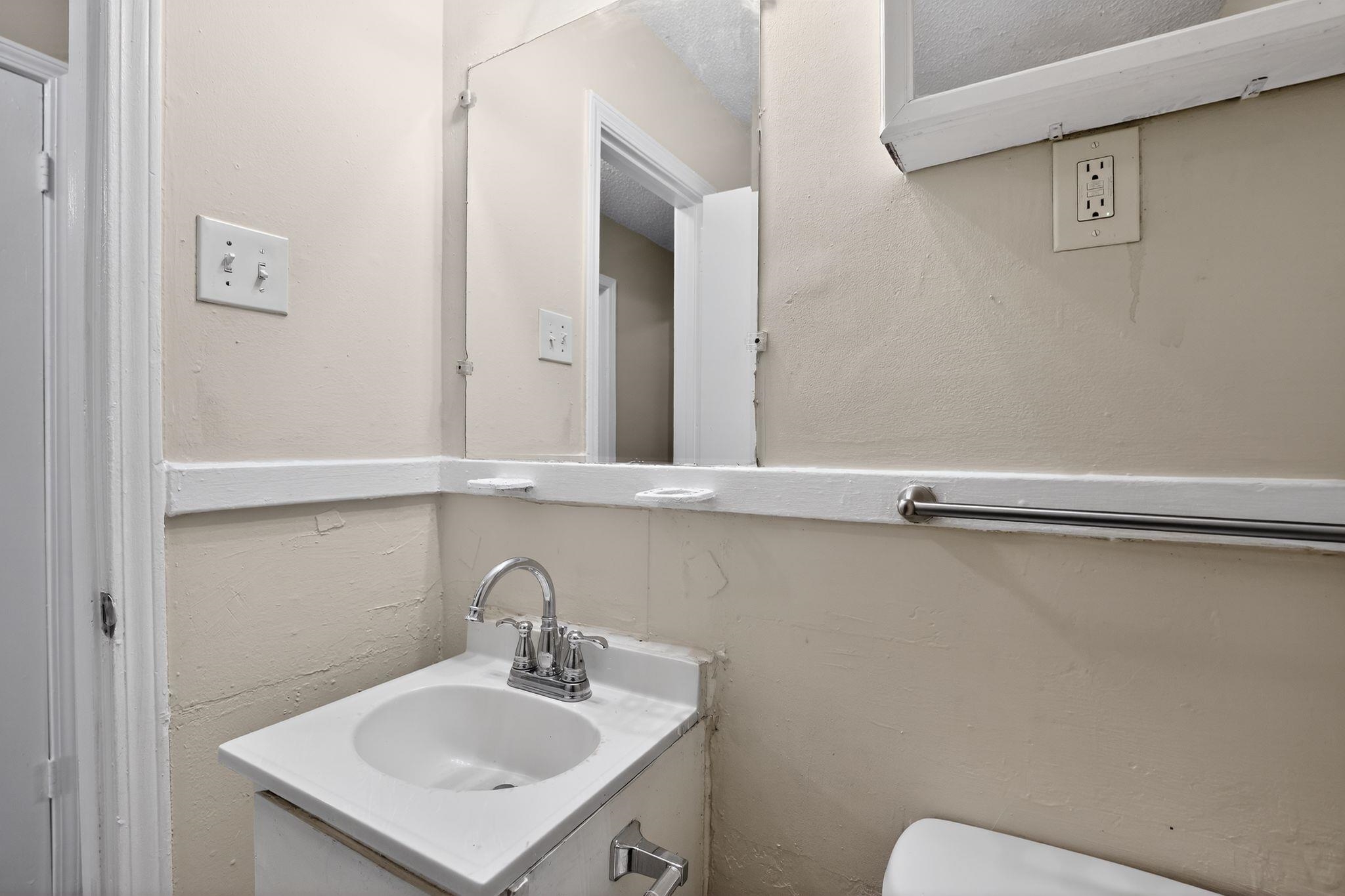 4212 Falcon Drive Memphis, TN 38109 - Photo 6 of 31 Bathroom with vanity and a textured wall