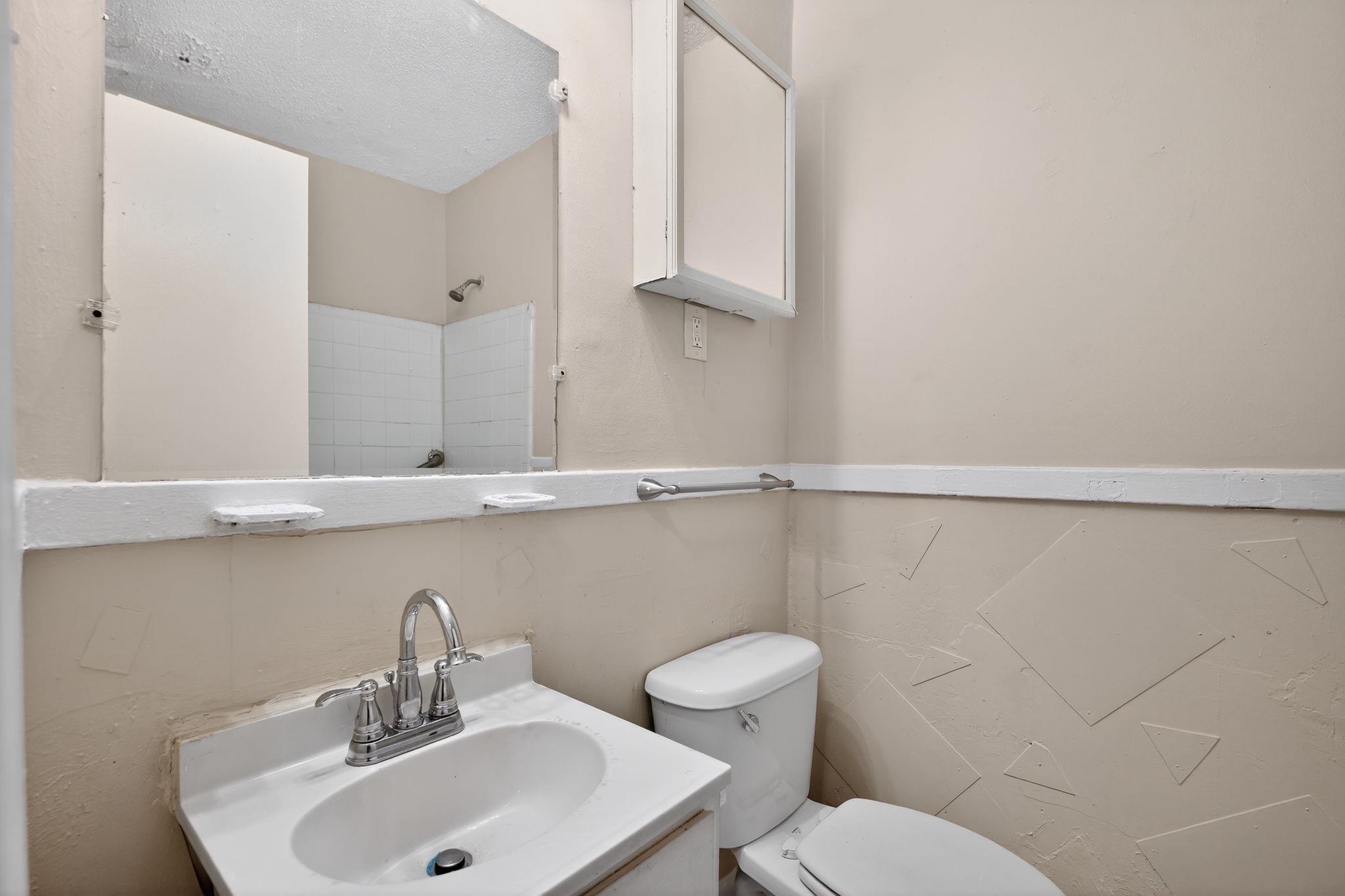 4212 Falcon Drive Memphis, TN 38109 - Photo 7 of 31 Bathroom featuring vanity and a shower