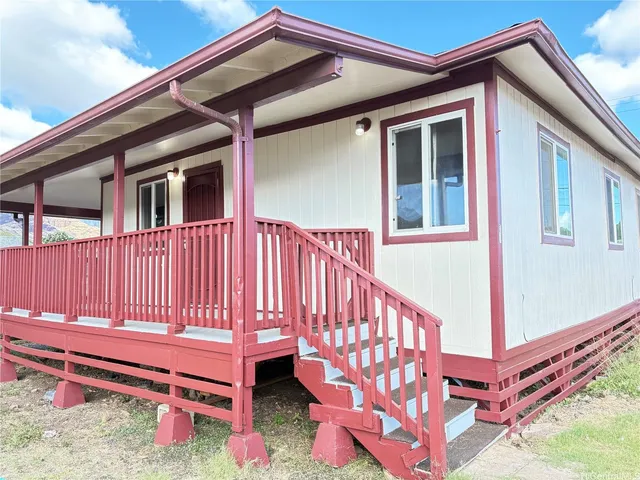 a backyard of a house with a bench