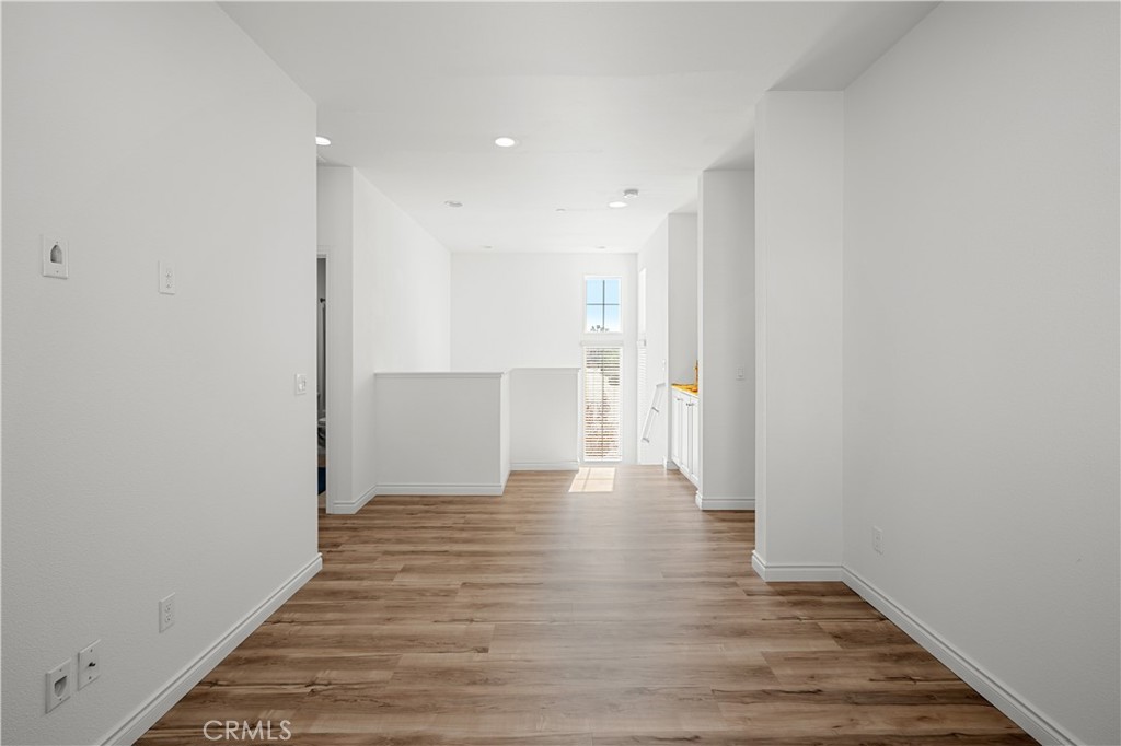 8652 Cava Drive Rancho Cucamonga, CA 91730 - Photo 13 of 28 a view of a hallway with wooden floor