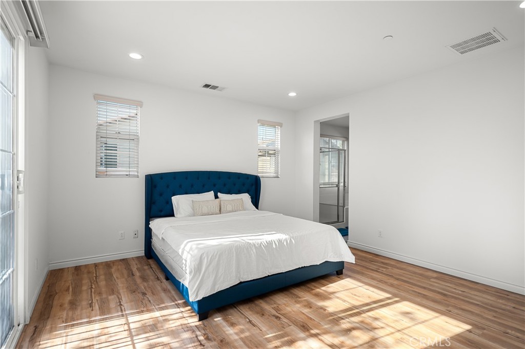 8652 Cava Drive Rancho Cucamonga, CA 91730 - Photo 14 of 28 a bedroom with a bed and a window