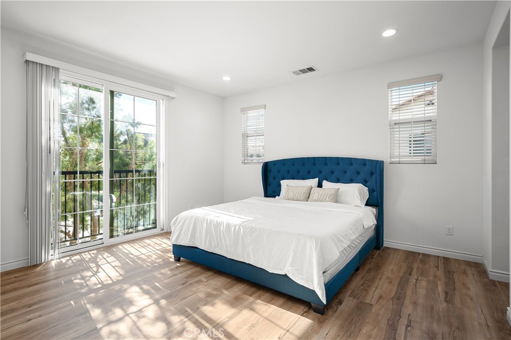8652 Cava Drive Rancho Cucamonga, CA 91730 - Photo 15 of 28 a bedroom with a large bed and a large window
