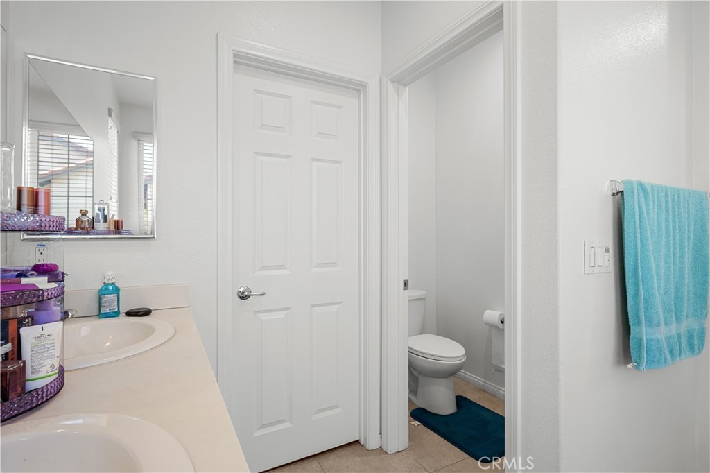 8652 Cava Drive Rancho Cucamonga, CA 91730 - Photo 18 of 28 a bathroom with a sink a toilet and shower