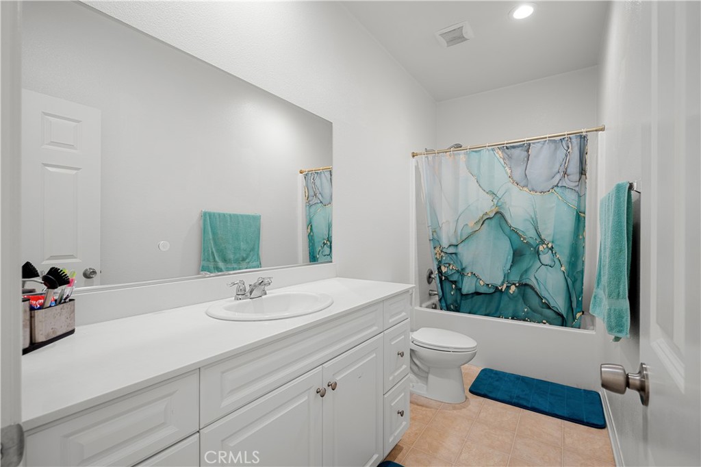 8652 Cava Drive Rancho Cucamonga, CA 91730 - Photo 20 of 28 a bathroom with a sink and a mirror