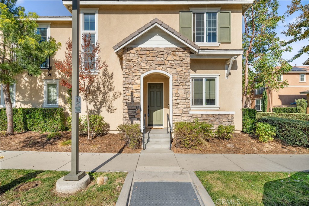 8652 Cava Drive Rancho Cucamonga, CA 91730 - Photo 2 of 28 a front view of a house with garden