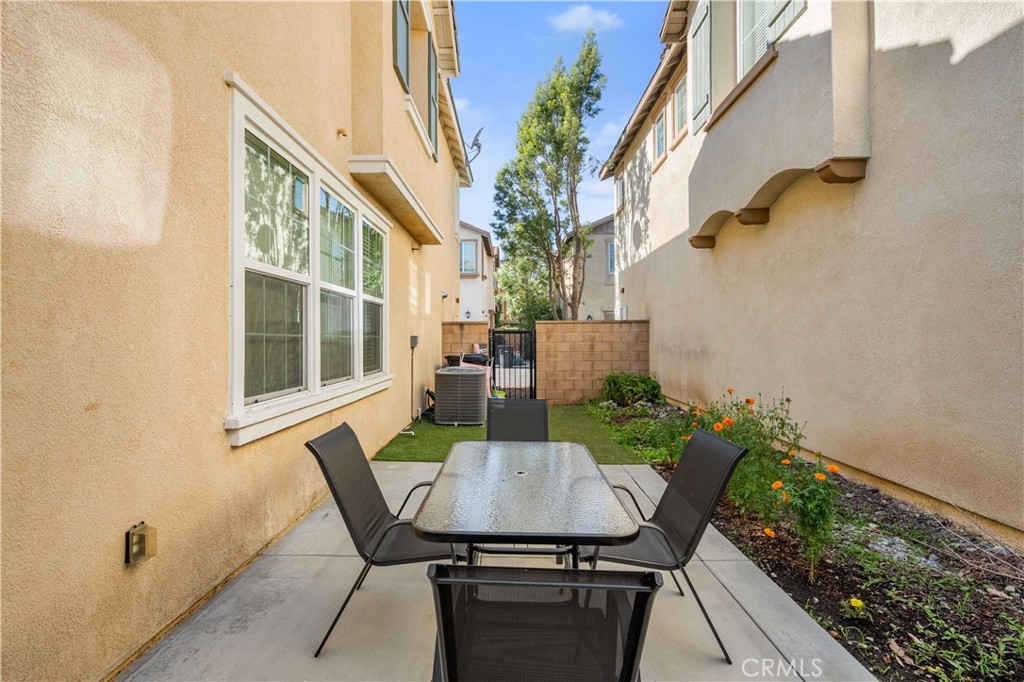 8652 Cava Drive Rancho Cucamonga, CA 91730 - Photo 23 of 28 a view of a balcony with table and chairs