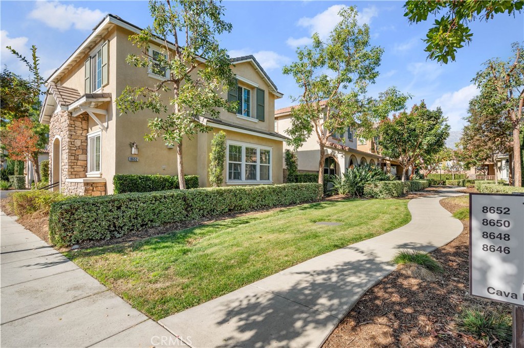 8652 Cava Drive Rancho Cucamonga, CA 91730 - Photo 4 of 28 front view of a house with a yard