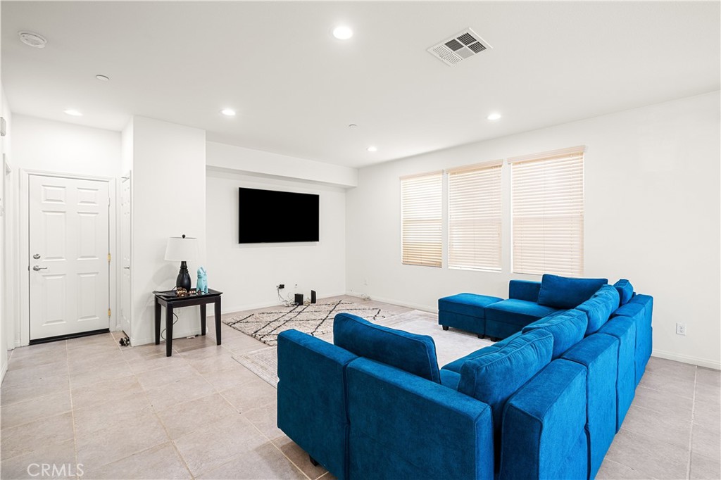 8652 Cava Drive Rancho Cucamonga, CA 91730 - Photo 6 of 28 a living room with furniture and a flat screen tv