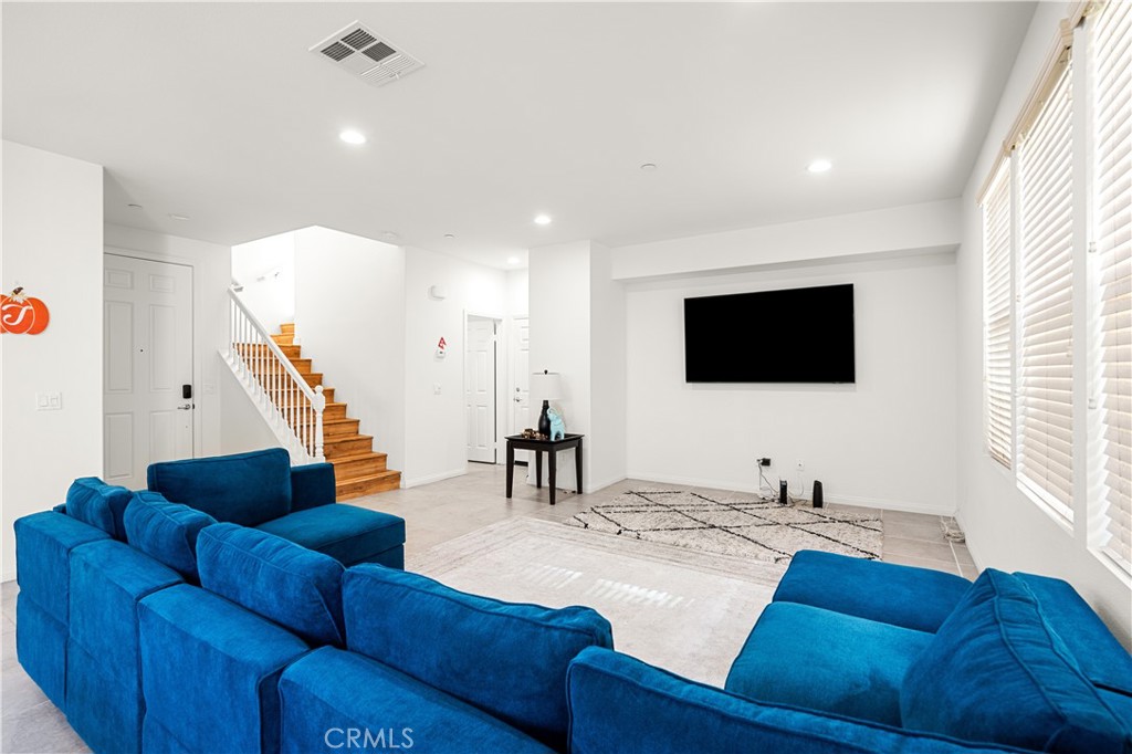 8652 Cava Drive Rancho Cucamonga, CA 91730 - Photo 7 of 28 a living room with furniture and a flat screen tv
