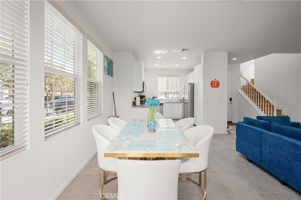 8652 Cava Drive Rancho Cucamonga, CA 91730 - Photo 8 of 28 a dining room with furniture and a kitchen area