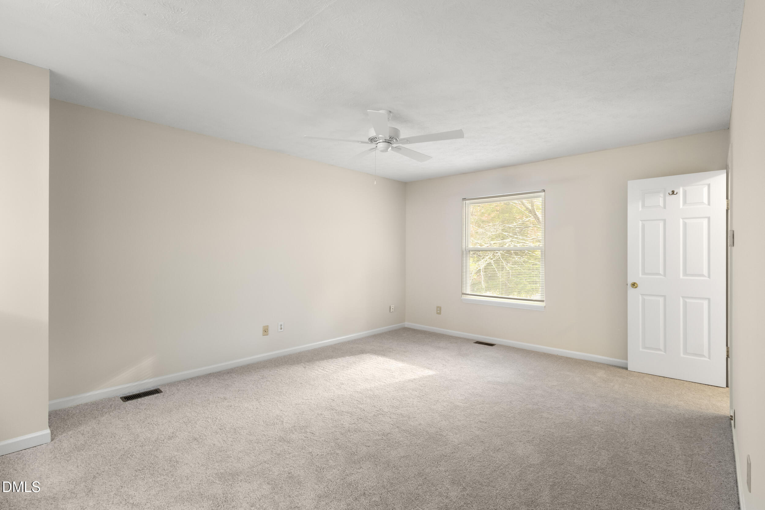 2001 Shenandoah Road Raleigh, NC 27603 - Photo 13 of 27 an empty room with a window and a ceiling fan