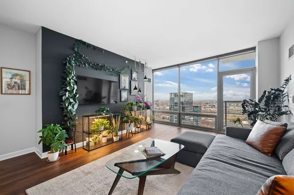 a living room with furniture and a large window