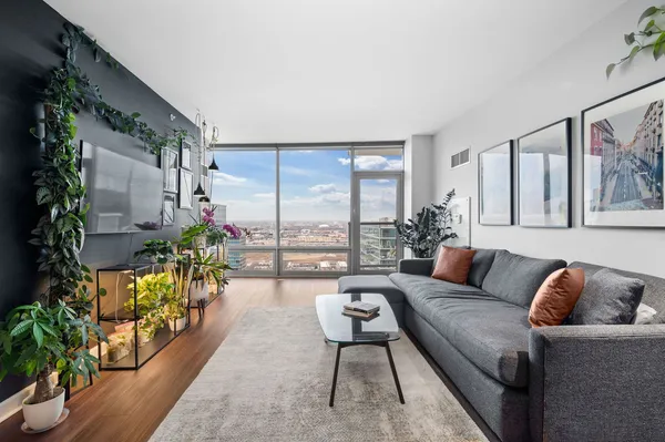 a living room with furniture and a large window