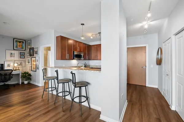 a view of kitchen with cabinets and wooden floor
