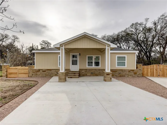 front view of a house with a patio