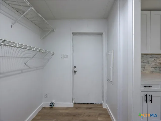 a view of a room with racks on the wall