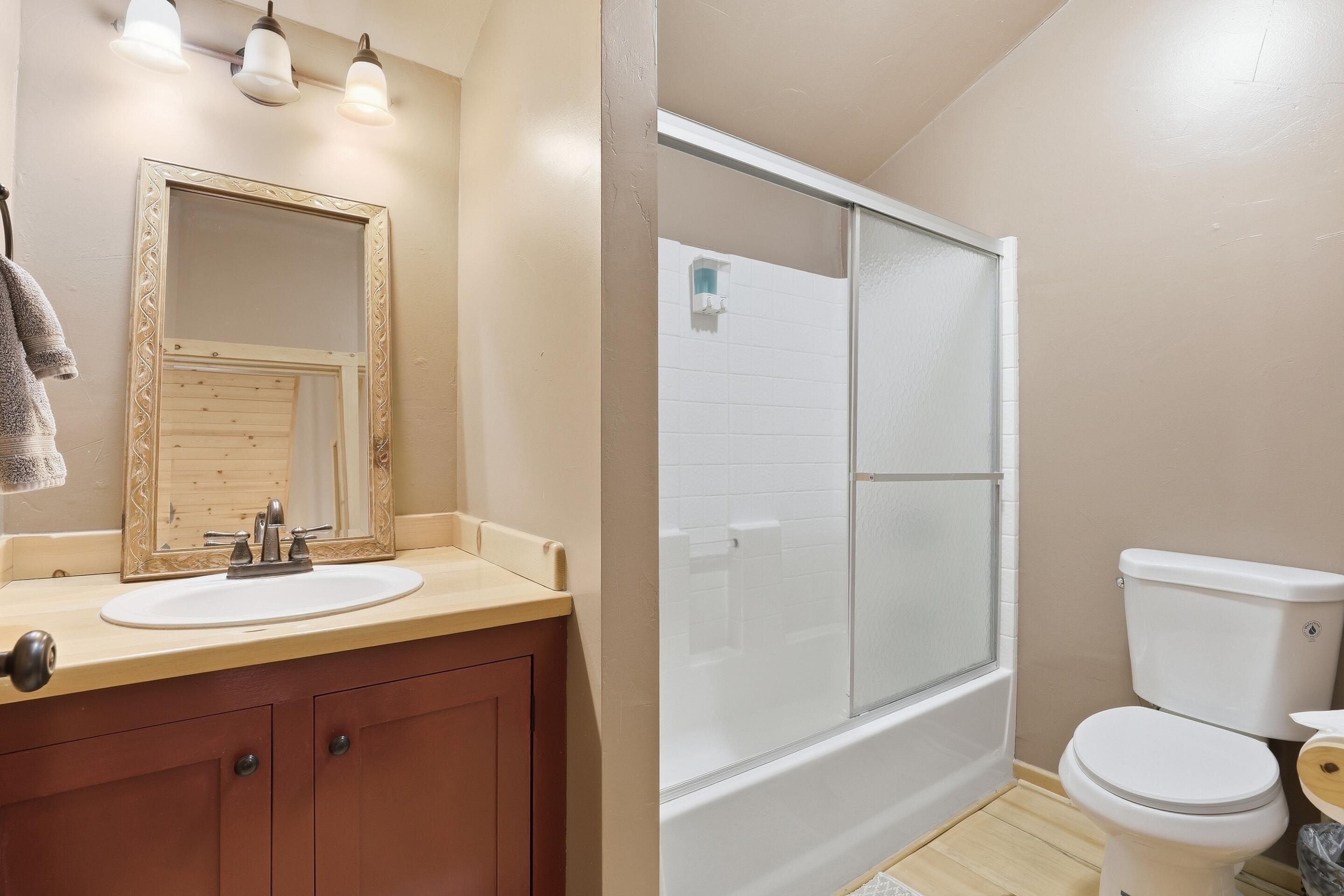 6322 Sharyn Road Pine, AZ 85544 - Photo 23 of 37 a bathroom with a sink a toilet a mirror and shower