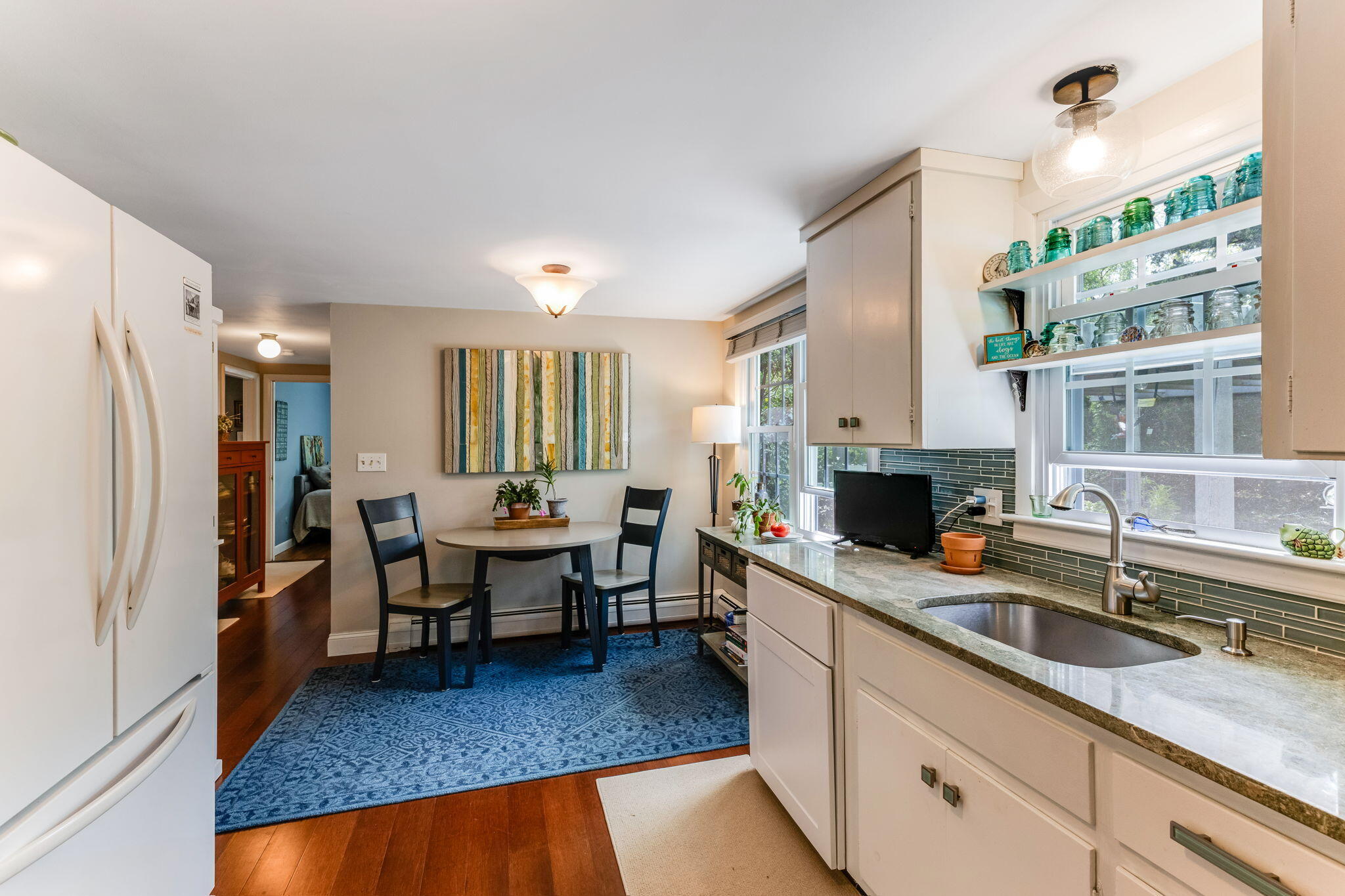 4975 State Highway, Unit A Eastham, MA 02642 - Photo 14 of 44 a very nice looking living room with a couch and a fireplace
