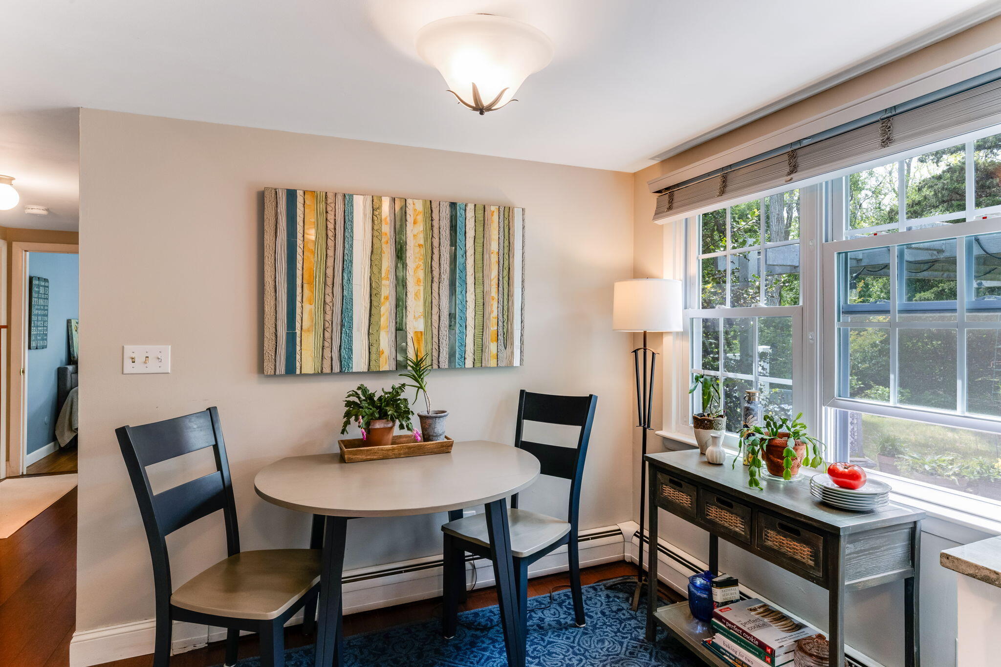 4975 State Highway, Unit A Eastham, MA 02642 - Photo 15 of 44 a room that has a table and a chair in it