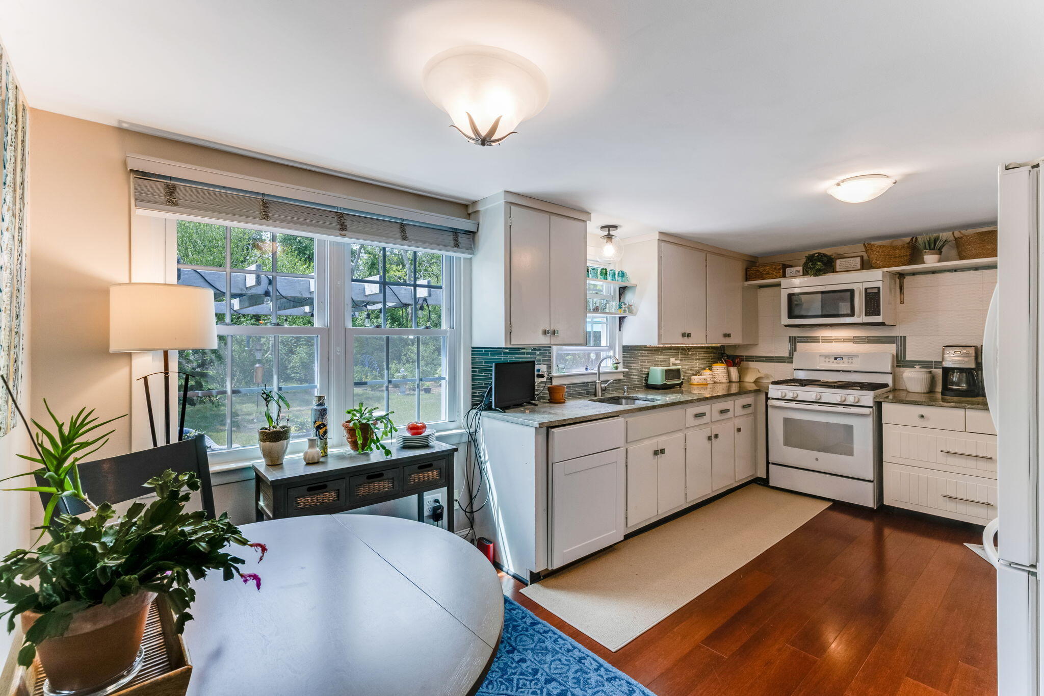 4975 State Highway, Unit A Eastham, MA 02642 - Photo 16 of 44 a kitchen with sink refrigerator and stove