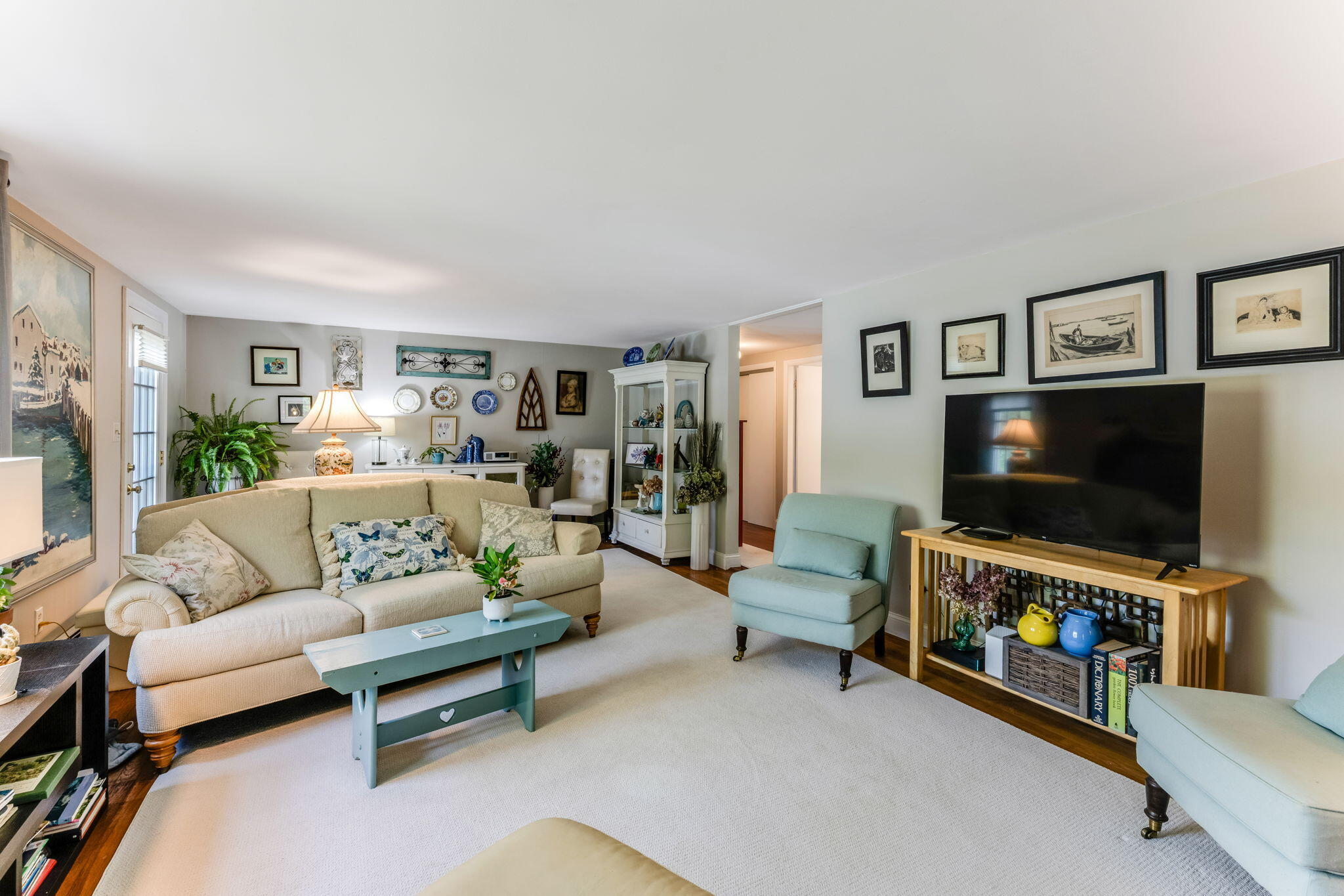 4975 State Highway, Unit A Eastham, MA 02642 - Photo 20 of 44 a living room with furniture and a flat screen tv
