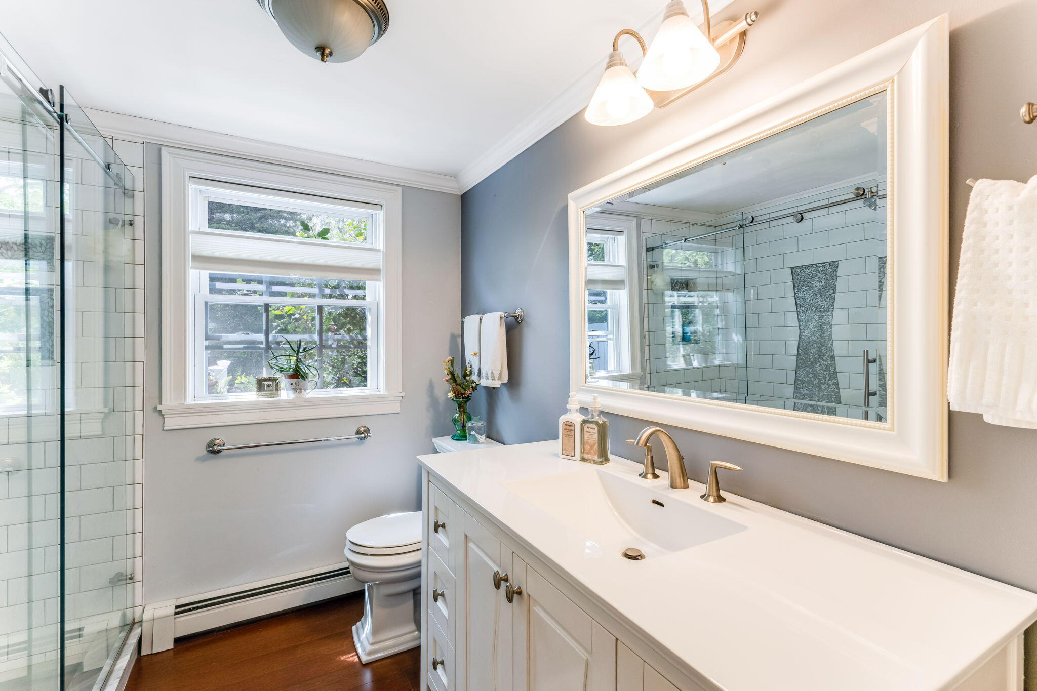 4975 State Highway, Unit A Eastham, MA 02642 - Photo 24 of 44 a bathroom with a toilet a sink and mirror