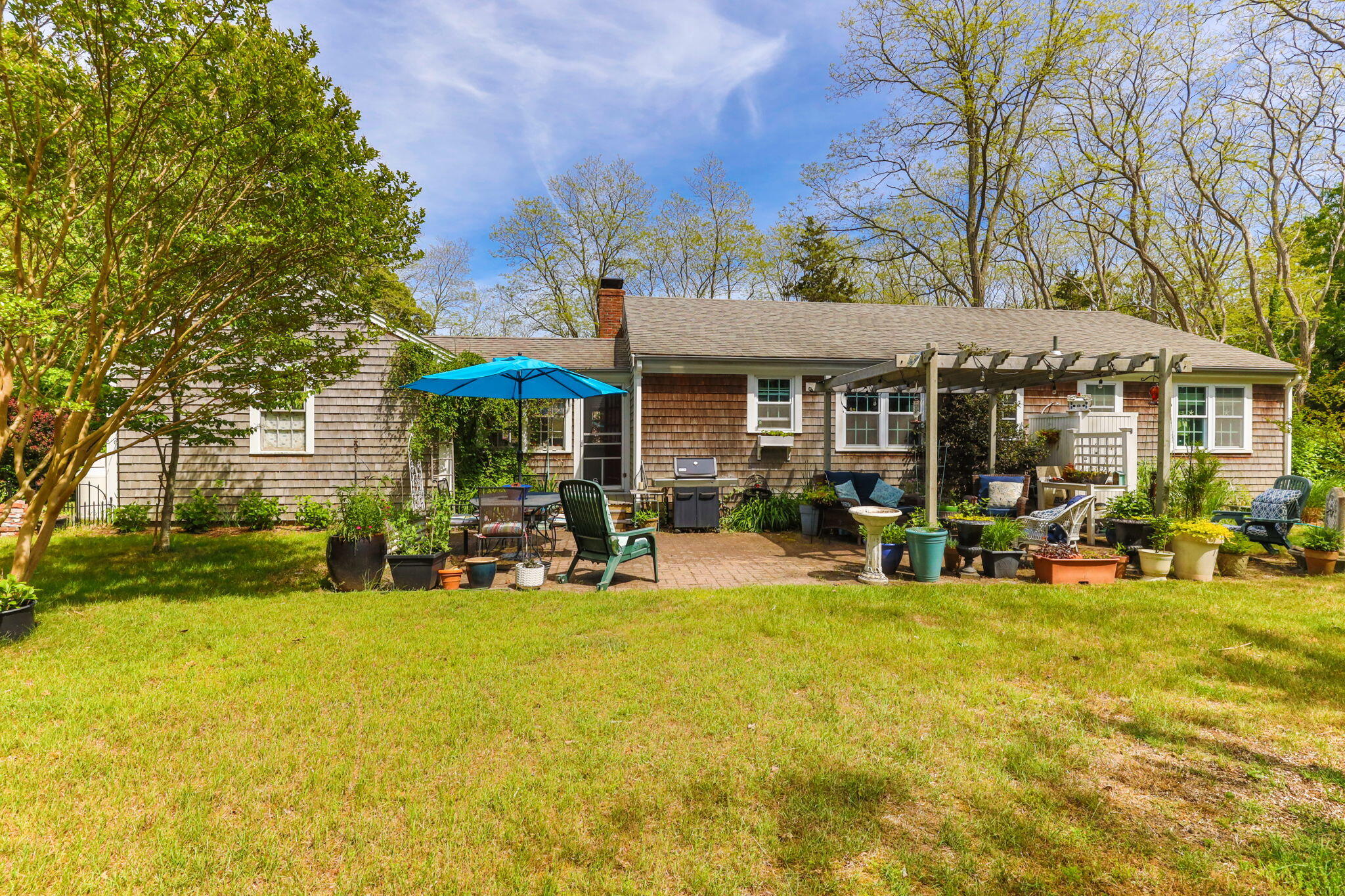 4975 State Highway, Unit A Eastham, MA 02642 - Photo 33 of 44 a view of a house with a patio