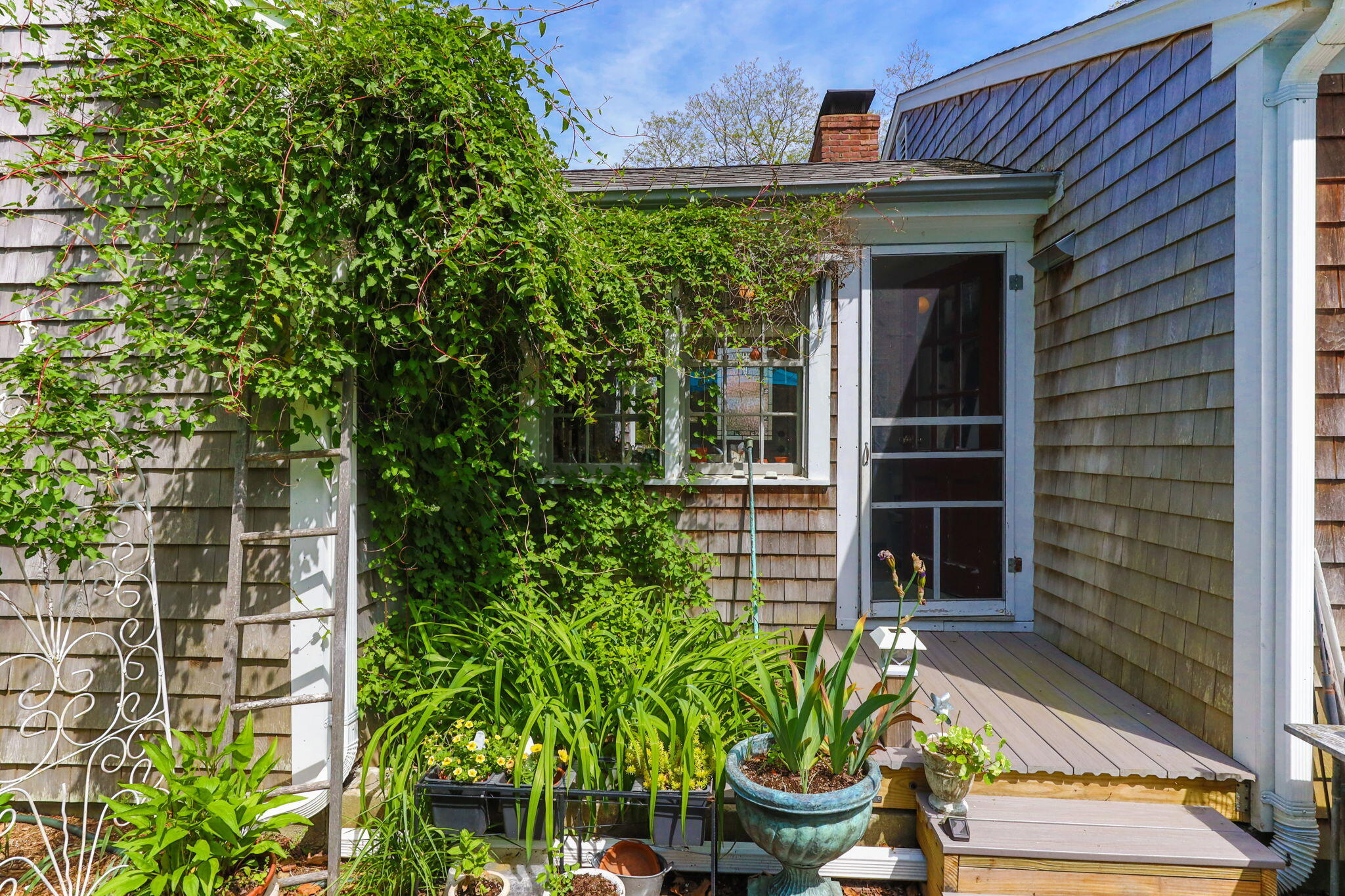 4975 State Highway, Unit A Eastham, MA 02642 - Photo 39 of 44 a front view of a house with a yard