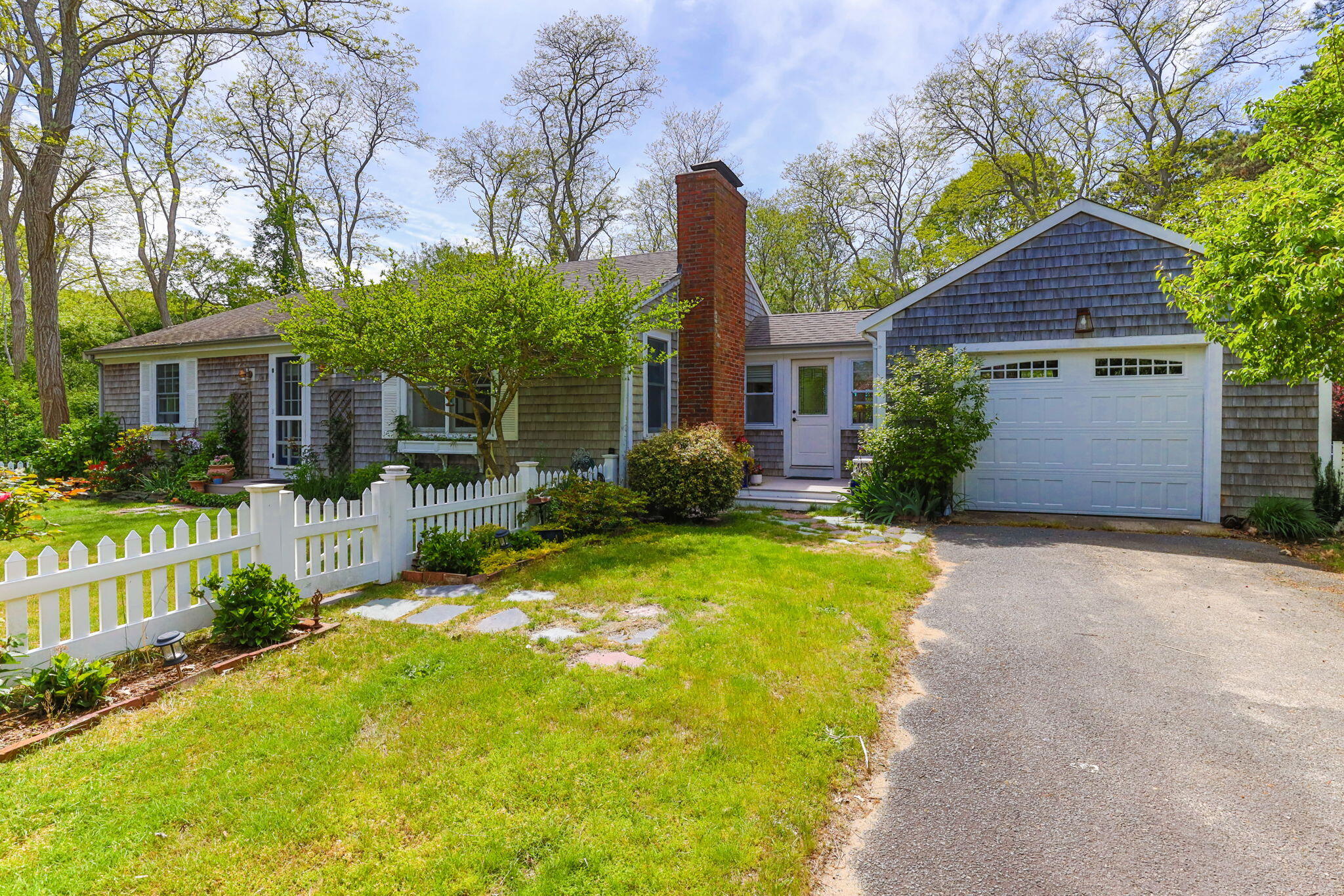 4975 State Highway, Unit A Eastham, MA 02642 - Photo 4 of 44 front view of a house with a yard