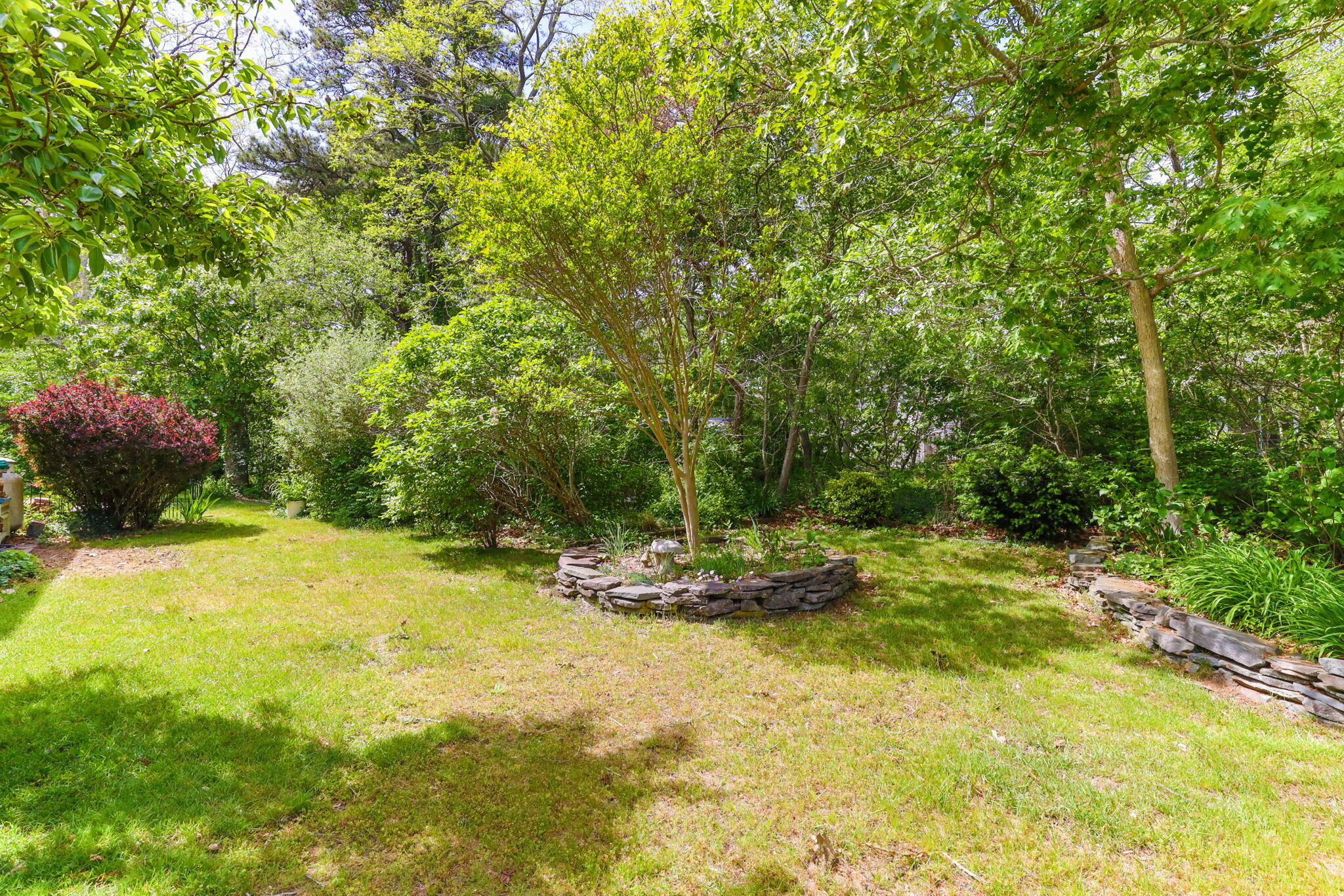 4975 State Highway, Unit A Eastham, MA 02642 - Photo 43 of 44 a view of a swimming pool with some plants and trees