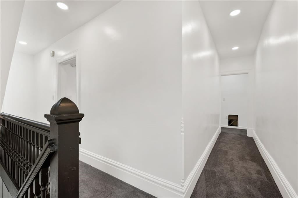 1619 Haug Street Pittsburgh, PA 15212 - Photo 11 of 27 a view of a hallway with wooden floor and staircase